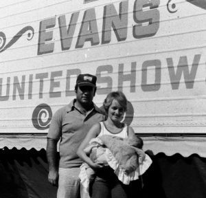 Tom and Nancy Evans of Evans United Shows holding their baby daughter Erin during the Clear Lake, Iowa July 4 celebration in the 1970s.