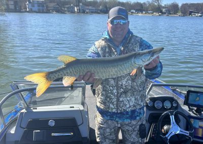 Mike Rouse holding a 33-inch muskie during the Stan Harrison Memorial Spring Tune-Up tournament on Clear Lake, Iowa