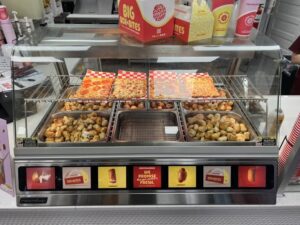 Flatbread pizzas in the hot case at Pretzelmaker